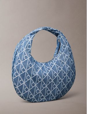 Bolsa-Calvin-Klein-Emblem-Aop-Denim-Tipo-Hobo-Mujer-Azul-4F3591G-YBN